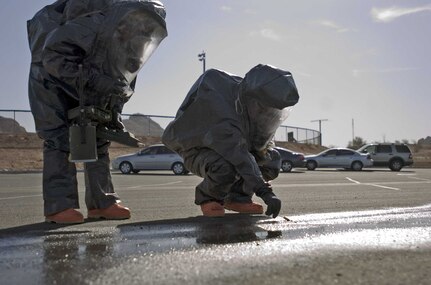 Soldiers of the 91st Weapons of Mass Destruction, Civil Support Team, Arizona National Guard analyze a simulated spill, Oct. 16 for nuclear material in support of Top Officials (TOPOFF) 4. The U.S. State Department sponsored TOPOFF exercise tests the readiness capabilities of state and federal agencies as they respond to simulated, real world events.