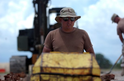 Airmen from the 474th Expeditionary Civil Engineering Squadron, Air National Guard, work on the foundation for the new commissions complex Sept. 18. The 474th broke ground Sept. 11 on the construction of the new Expeditionary Legal Complex where Military Commissions will resume pending court review.