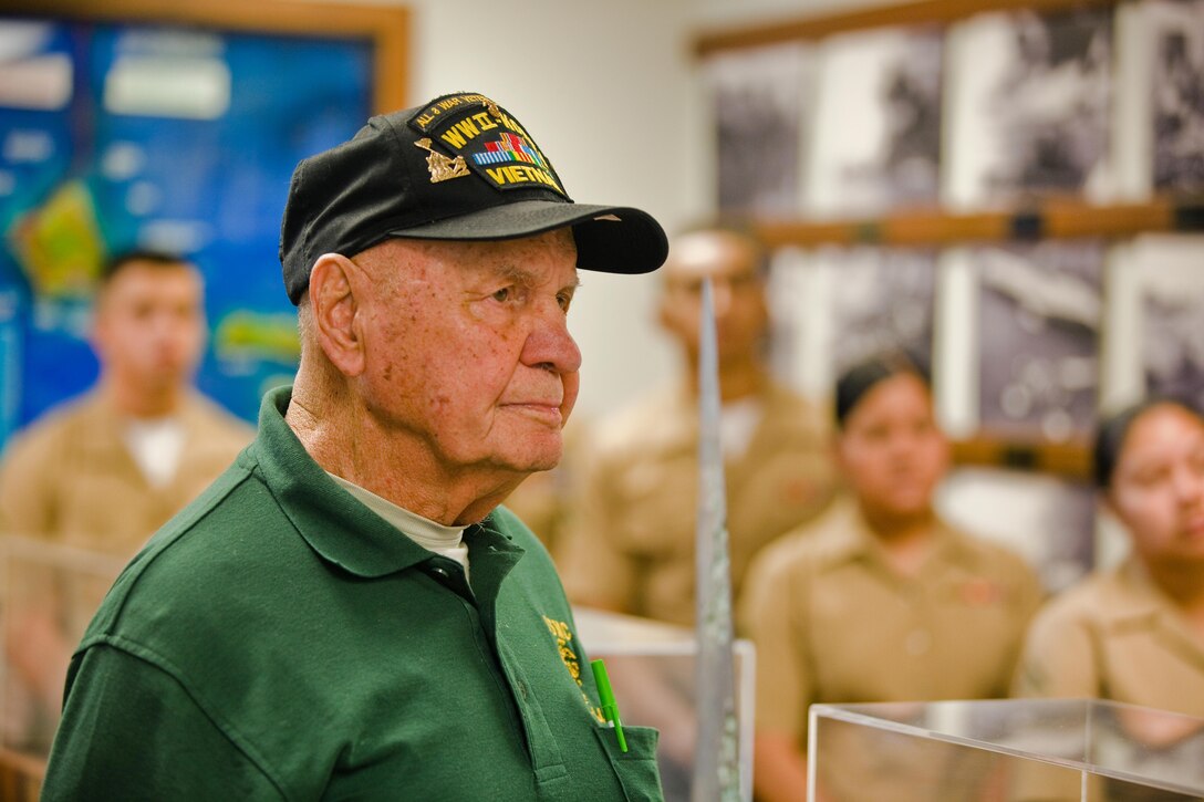 Retired Fleet Marine Forces Pacific Sergeant Major "Iron Mike" Mervosh and Marines from U.S. Marine Corps Forces, Pacific and Marine Corps Base Hawaii get a briefing on the history of the 1941 attack on Pearl Harbor from Pacific Fleet Boathouse Sailors before embarking on a boat tour of historic sites around Ford Island, April 2.  Mervosh, who is vacationing in Hawaii, told the Marines present that he enjoyed meeting each of them, and that they help him keep his connection to the Marine Corps and his motivation alive and strong.  Mervosh, who will be 90 in June, also encouraged them to follow his example; he still "PTs" four times weekly.  Mervosh served in World War II, Korea and Vietnam and retired in 1977 with nearly 20 years in grade as a sergeant major.