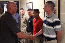 Brigadier General Richard L. Simcock, II, Deputy Commander, US Marine Corps Forces Pacific, left, shakes hands with Corporal German Trevizo, of Marine Corps Activity Guam during his visit aboard U.S. Naval Computer and Telecommunications Station Guam, April 3, 2013.  BGen. Simcock visited the island during a tour of the Pacific forces and to see more of the realignment in the region.