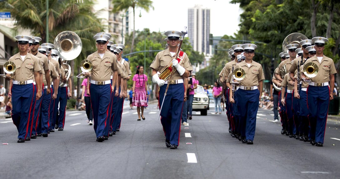 HONOLULU - The Marine Corps Forces, Pacific band marches down Kalakaua Avenue toward Kapiolani Park during the 11th annual Prince Kuhio Commemoration Parade in Honolulu, March 23. The parade commemorated the life and events of Prince Jonah Kuhio Kalanianaole for various achievements, such as the Hawaiian Homestead Act of 1921 and being the first Hawaiian elected to the U.S. Congress. (U.S. Marine Corps photo by Lance Cpl. Matthew Bragg)