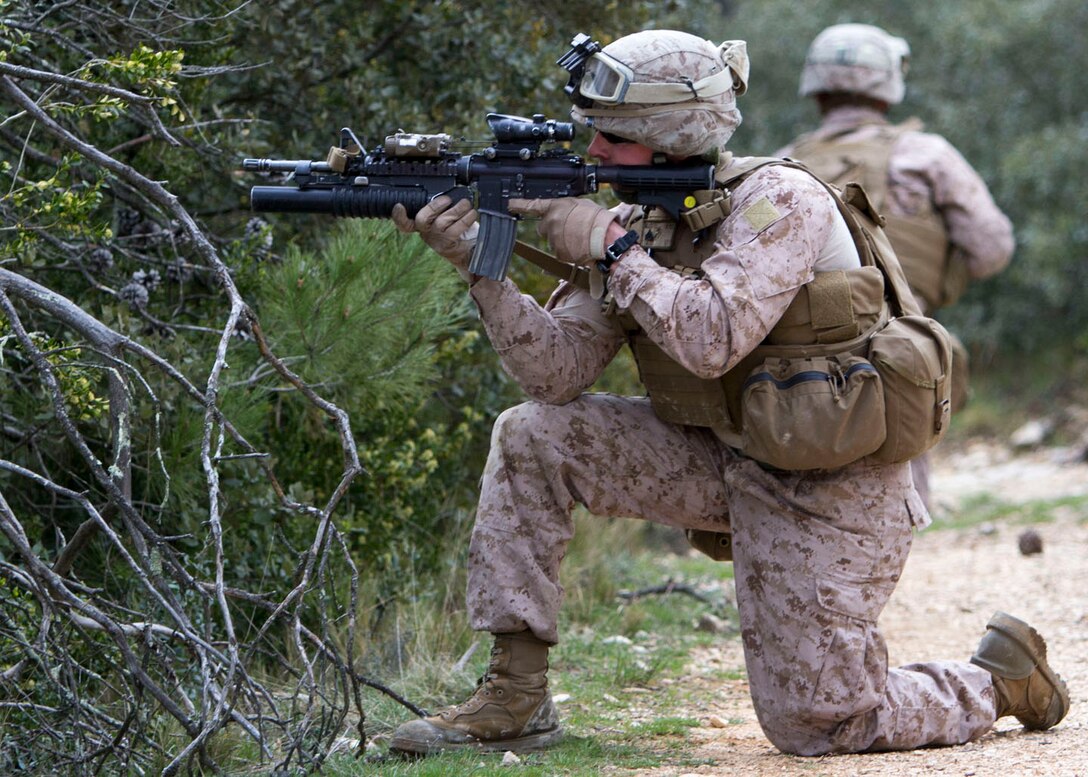 A U.S. Marine assigned to India Company, Battalion Landing Team 3/2, 26th Marine Expeditionary Unit (MEU), participates in a movement to contact exercise in tangent with French Legionnaires assigned to the 6th Light Armored Brigade, 2nd Foreign Legion Regiment, 5th Company, aboard Le Camp Des Garrigues, Nimes, France, March 27, 2013. The 26th MEU is deployed to the 6th Fleet area of operation. The MEU operates continuously across the globe, providing the president and unified combatant commanders with a forward-deployed, sea-based, quick-reaction force. The MEU is a Marine Air-Ground Task Force capable of conducting amphibious operations, crisis-response and limited contingency operations. (U.S. Marine Corps photo by Cpl. Kyle N. Runnels/Released)
