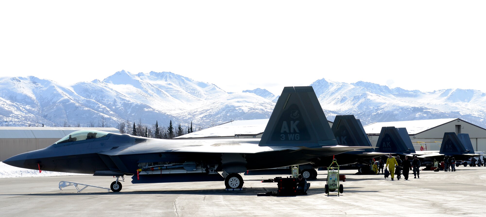 F-22 Raptors sit on the flight line during Polar Force 13-3 Exercise on Joint Base Elmendorf-Richardson April 3. The exercise is designed to validate the wings' ability to integrate, mobilize, and prepare assigned personnel, aircraft and equipment for their wartime mission and to employ forces and weapons systems to perform tasked missions. (U.S. Air Force photo/ Airman 1st Class Tammie J. Ramsouer)