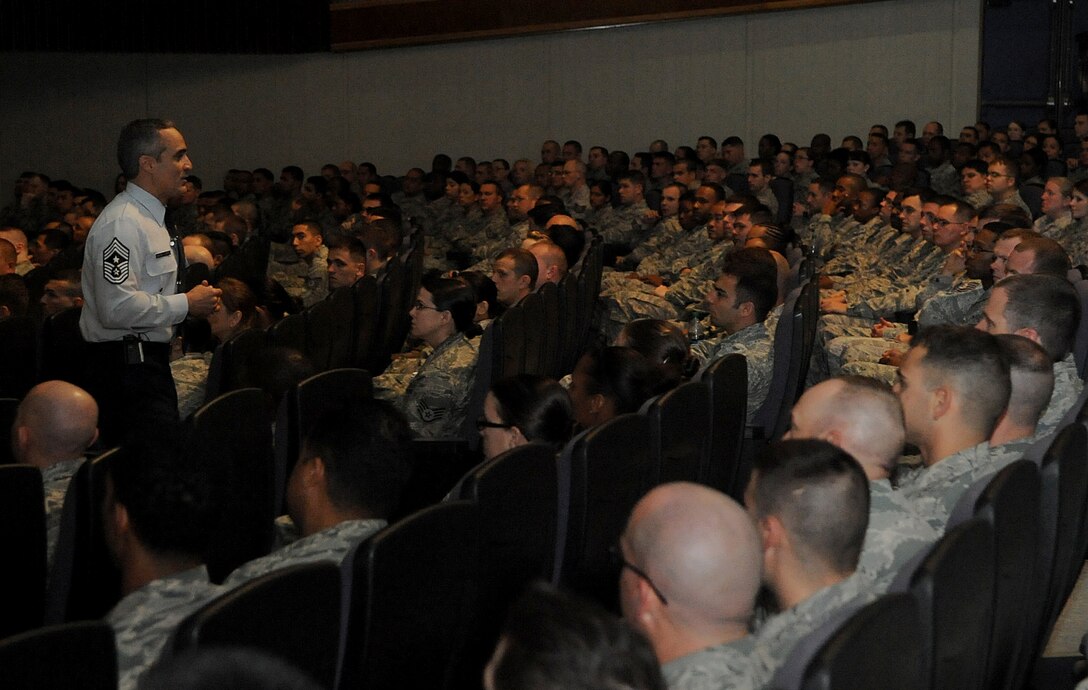 U.S. Air Force Chief Master Sgt. Ramon Colon-Lopez, 18th Wing command chief, speaks to a group of NCOs during an enlisted all-call on Kadena Air Base, Japan, April 4, 2013. This all-call targeted three specific groups; Airmen, NCOs and senior NCOs, to reemphasize their roles and responsibilities along with answer questions these groups may have had. (U.S. Air Force photo by Staff Sgt. Laszlo Babocsi/Released)