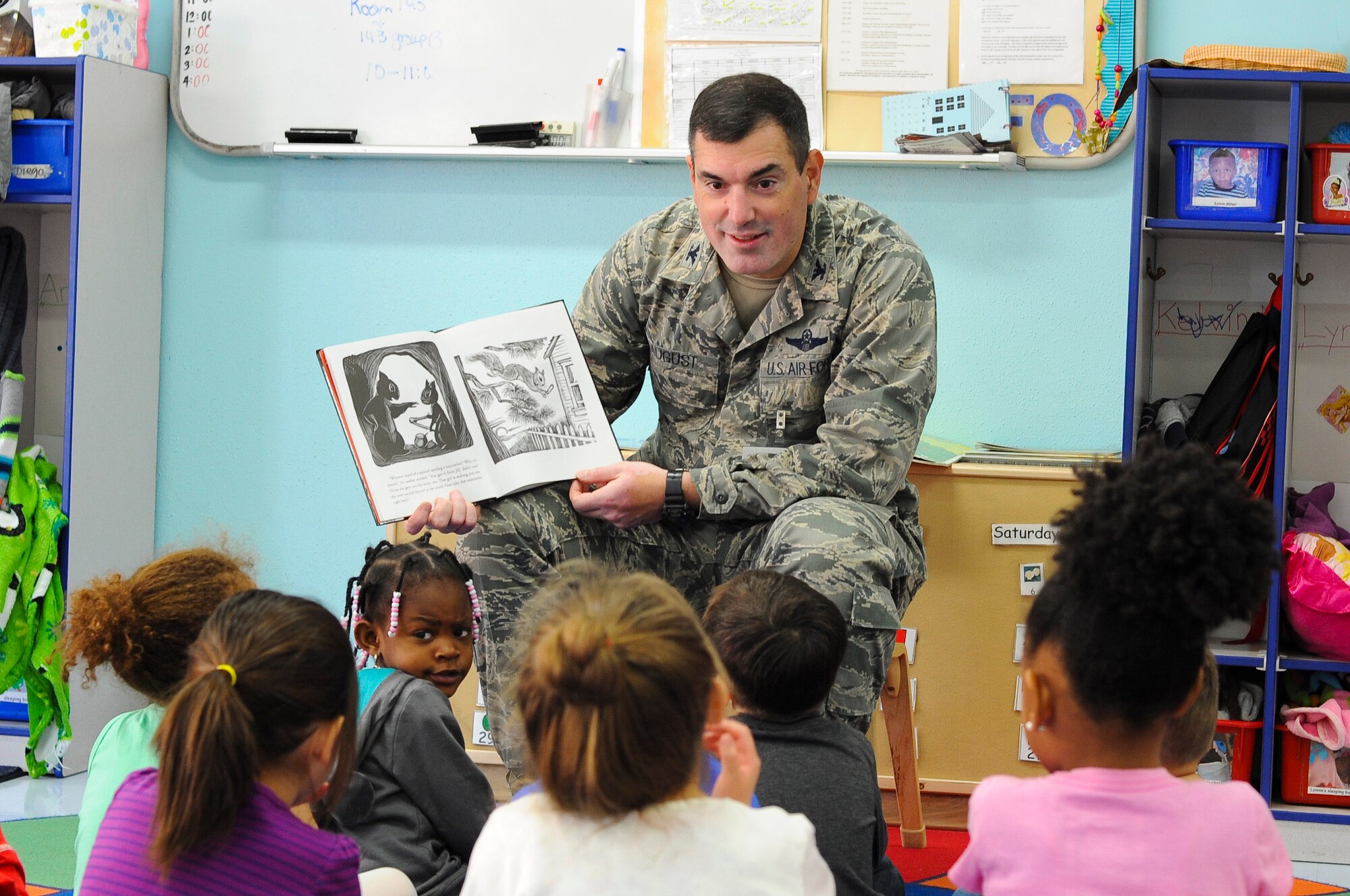 YOKOTA AIR BASE, Japan -- Col. Mark August, 374th Airlift Wing commander, reads to children at the Yume Child Development Center at Yokota Air Base, Japan, April 4, 2013.  In support of the Month of the Military Child, August read a few books followed by hugs. (U.S. Air Force photo by Airman 1st Class Desiree Economides)