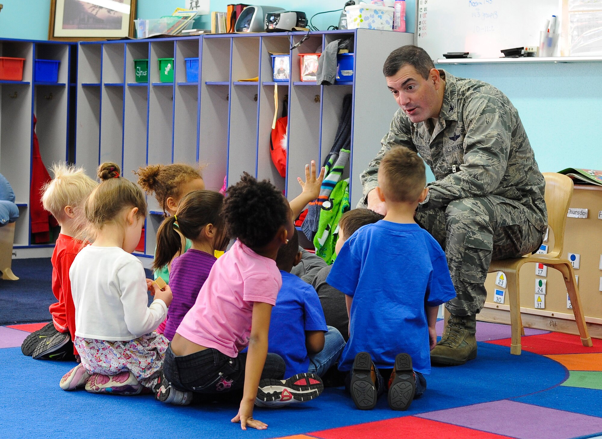 YOKOTA AIR BASE, Japan -- Col. Mark August, 374th Airlift Wing commander, reads to children at the Yume Child Development Center at Yokota Air Base, Japan, April 4, 2013. Several base leaders are scheduled to read at other locations in support of the Month of the Military Child. (U.S. Air Force photo by Airman 1st Class Desiree Economides)