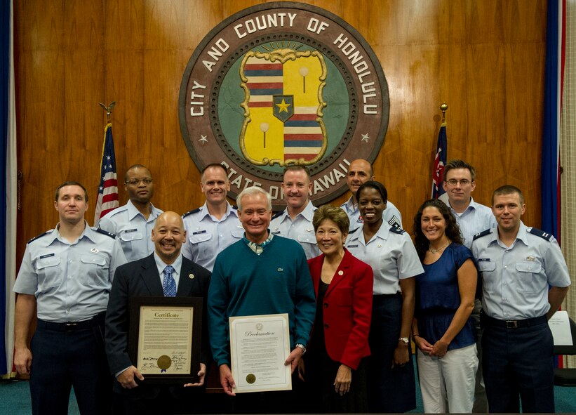 Members of the 15th Wing pose with Ernest Martin, Honolulu City Council chairman, (front left) Kirk Caldwell, Honolulu city mayor, (front middle) and Carol Fukunaga, Honolulu City Council member, (front right) after the Sexual Assault Awareness Month proclamation and certificate ceremony in the city council chamber in Honolulu, Hawaii, April 2, 2013. The city council gathered key members of the local community for the proclamation signing to send a strong, visible message of the ongoing team effort to support victims and bring perpetrators to justice. (U.S. Air Force photo/Staff Sgt. Terri Paden)