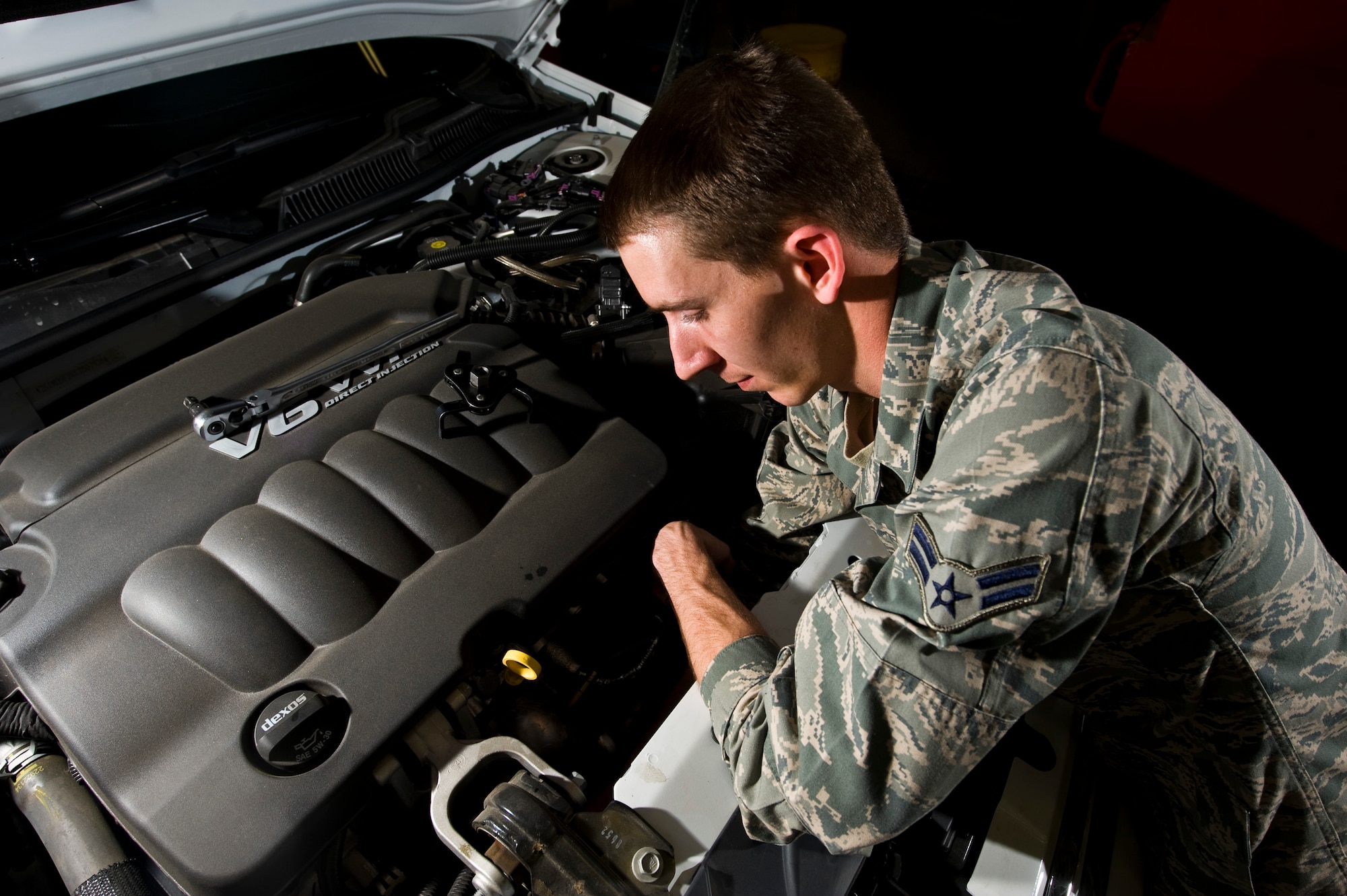 Airman 1st Class William Hendrickson, 99th Logistics Readiness Squadron vehicle maintenance specialist, changes the oil filter on a 99th Security Forces Squadron Vehicle April 4, at the 99th LRS maintenance hangar. The 99th LRS services vehicles assigned to units on Nellis, Creech and the Nevada Test and Training Range in order to help accomplish the installation’s training an operational mission. (U.S. Air Force photo by Airman 1st Class Jason Couillard)