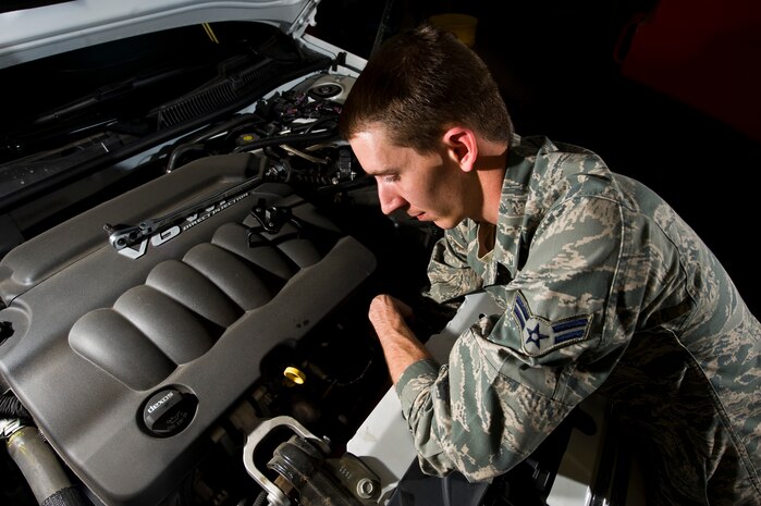 Airman 1st Class William Hendrickson, 99th Logistics Readiness Squadron vehicle maintenance specialist, changes the oil filter on a 99th Security Forces Squadron Vehicle April 4, at the 99th LRS maintenance hangar. The 99th LRS services vehicles assigned to units on Nellis, Creech and the Nevada Test and Training Range in order to help accomplish the installation’s training an operational mission. (U.S. Air Force photo by Airman 1st Class Jason Couillard)