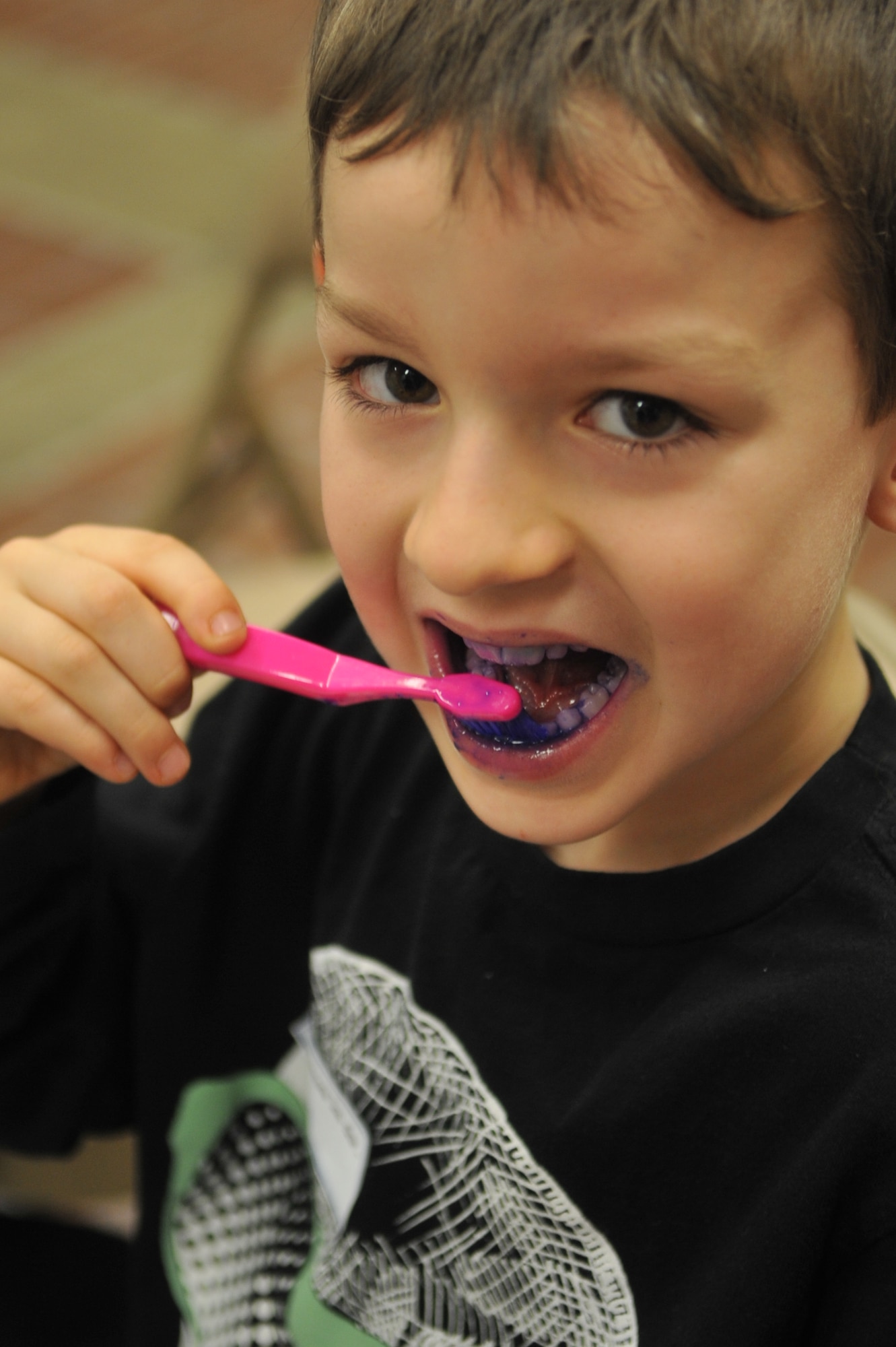 Connor Freed, 7, brushes his teeth during the Home School Dental Program at hospital on Osan Air Base, Republic of Korea, April 2, 2013. The program provided a child friendly environment aimed at encouraging proper dental hygiene in an effort to form good habits that can follow them into adulthood. (U.S. Air Force photo/Tech. Sgt. Raymond Mills) 