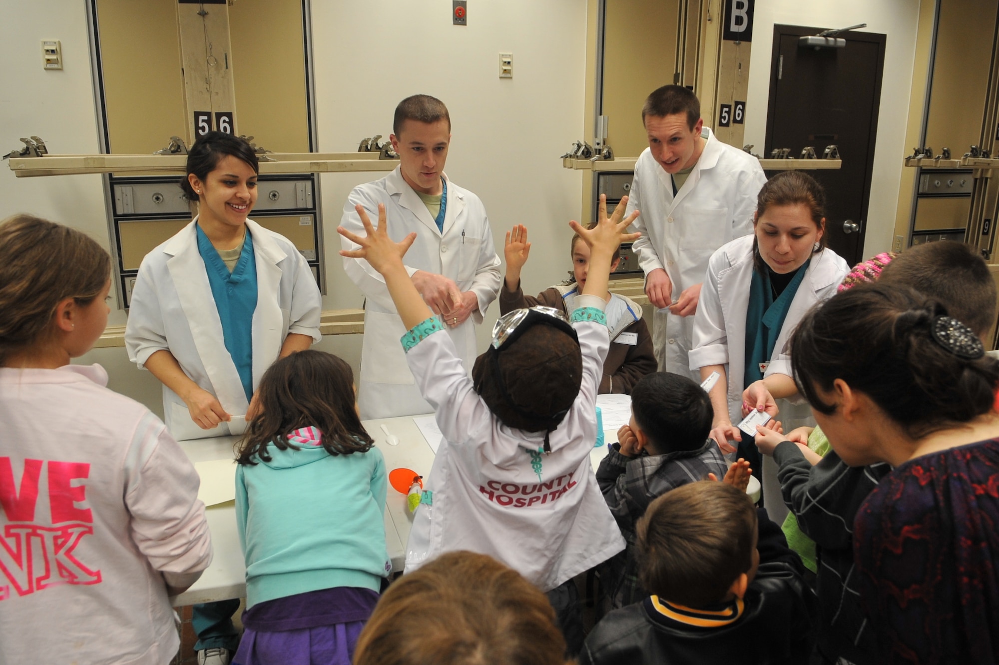 Members from the 51st Medical Group Dental Squadron teach children how to properly conduct oral hygiene during the Home School Dental Program at the hospital on Osan Air Base, Republic of Korea, April 2, 2013. By educating children early on, dental technicians hope to form good habits that can be carried throughout life. (U.S. Air Force photo/Tech. Sgt. Raymond Mills) 