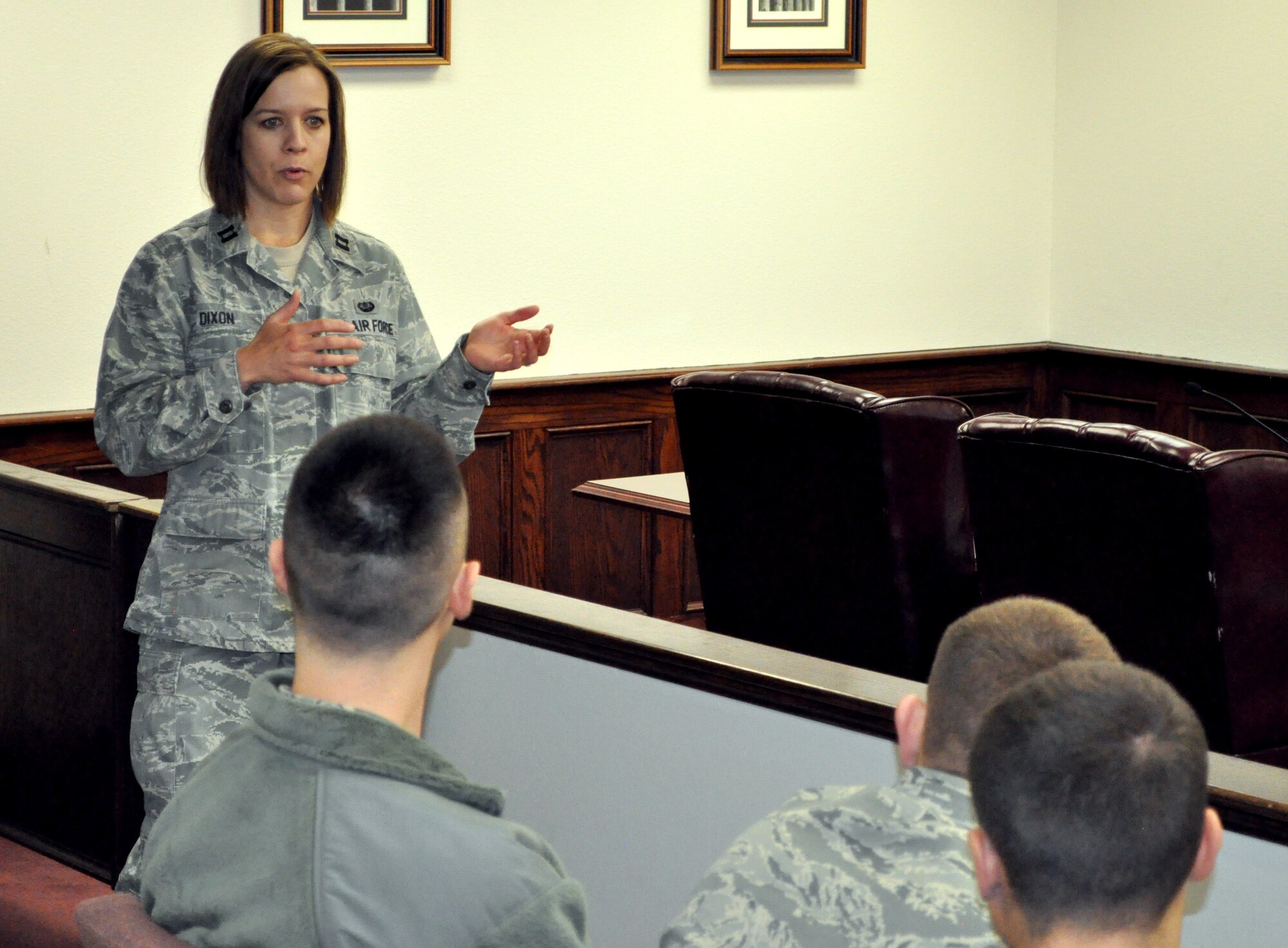Capt. Erin Dixon, 375th Air Mobility Wing judge advocate general, talks about the court martial process to first-term Airmen during the tour of different organizations that assist victims of sexual assault March 28, 2013.  The tour raised awareness for these young Airmen by showing them where these organizations are on base and what services they provide.  (U.S. photo/Staff Sgt. Maria Bowman)