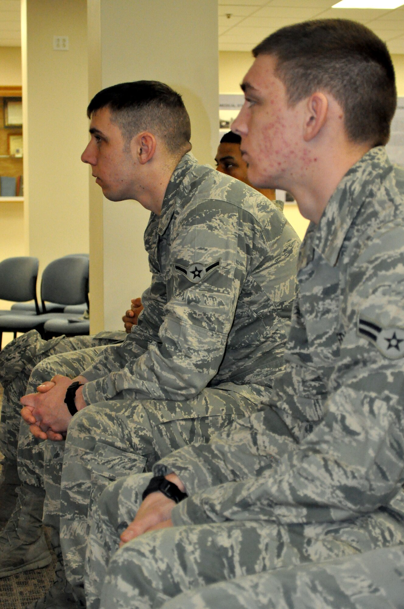 Airman Joseph Martin, 375th Medical Group logistics technician, listens to the briefing by Mental Health of the benefits provided to sexual assault victims or anyone needing to see a mental health physician during a base tour for a first-term Airman's class March 28, 2013.  Martin, 19 years old, joined the Air Force July 2012.  The tour introduced the class to the different organizations involved with assisting sexual assault victims.  (U.S. photo/Staff Sgt. Maria Bowman)