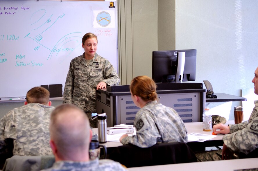 Second Lt. Elizabeth Levri, 319th Force Support Squadron Military Personnel Section, briefs University of North Dakota Army Reserve Officer Training Corps (ROTC) cadets about their upcoming permanent change of station requirements at UND Campus Grand Forks, N.D., April 2, 2013. The Grand Forks Air Force Base Traffic Management Office and Military Personnel Section volunteered to brief the soon-to-be-commissioned Army ROTC cadets about what to do before moving to their first duty station. (U.S. Air Force photo/Staff Sgt. Amanda N. Grabiec)