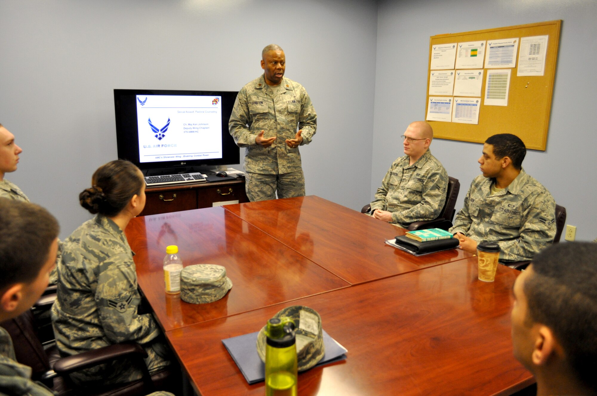 Maj. Ken Johnson, 375th Air Mobility Wing deputy chaplain, talks about how chaplains assist sexual assault victims by providing a safe environment for them to talk during a base tour for a first-term Airman's class March 28, 2013.  The tour introduced the class to the different organizations involved with assisting sexual assault victims.  (U.S. photo/Staff Sgt. Maria Bowman)