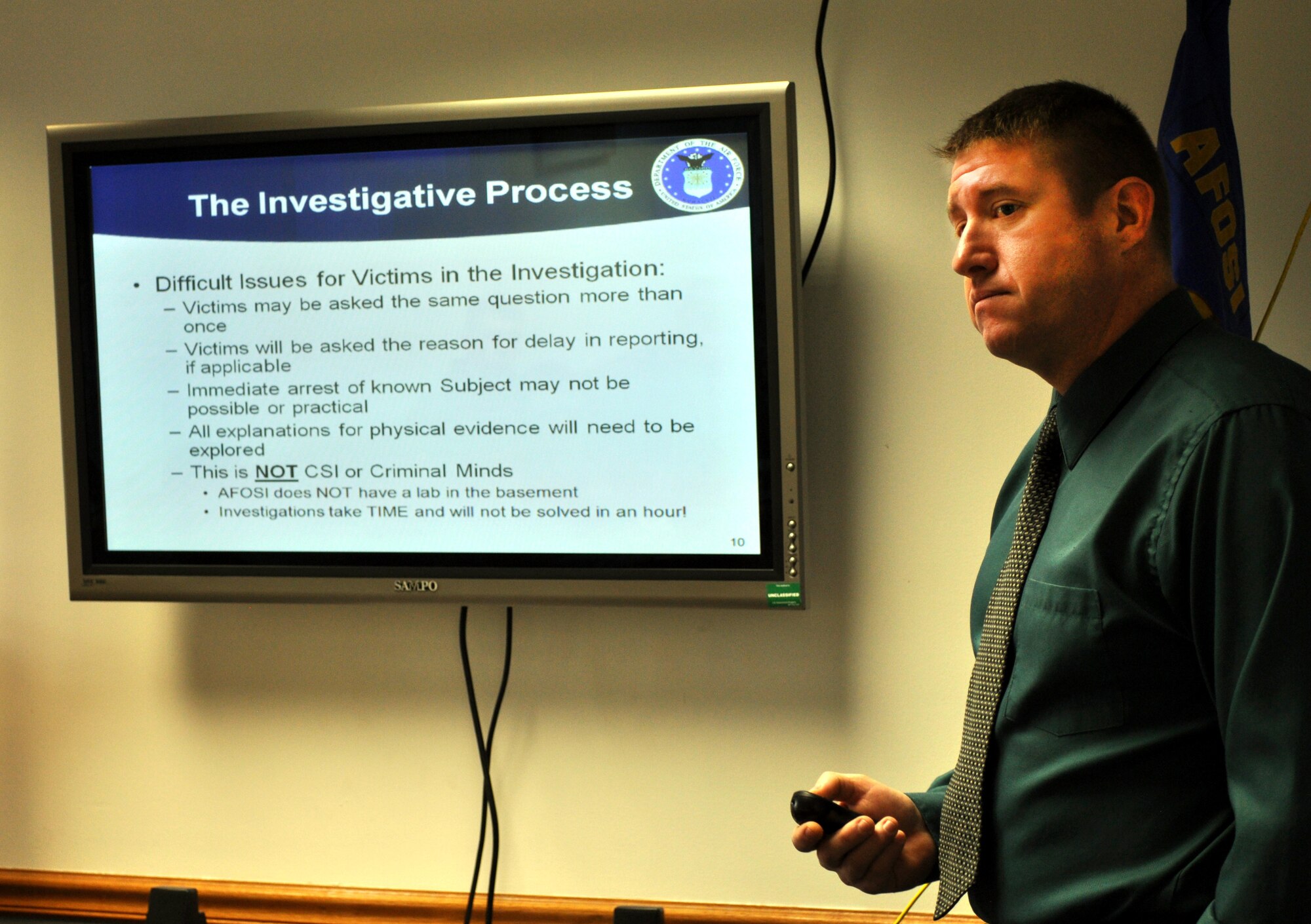 Office of Special Investigations Special Agent Steve Houghton teaches class of young Airmen about the investigative process when there is a sexual assault case during their base tour March 28, 2013.  The tour introduced the class to the different organizations involved with assisting sexual assault victims.  (U.S. photo/Staff Sgt. Maria Bowman)