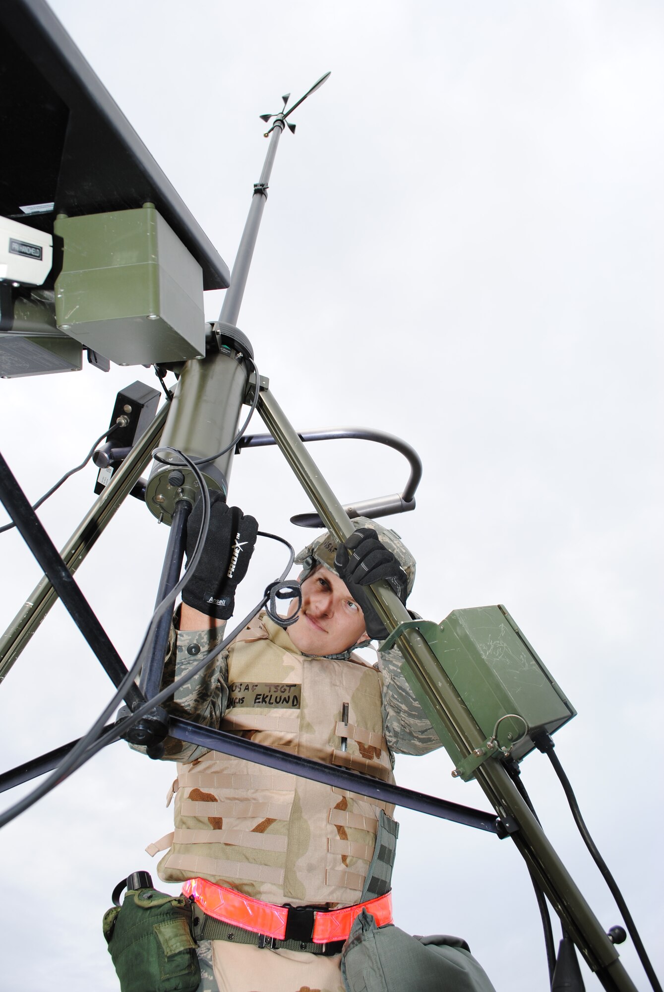 The 319th Operations Support Squadron Weather Flight NCO, Tech. Christopher Eklund, sets up weather monitoring equipment during a readiness exercise, which took place March 1, 2013, on Grand Forks Air Force Base, N.D. In the field and focused on operational weather; the Weather Flights are the third tier of Air Force Weather and the prime interface with an installation's flying and ground operations. (U.S Air Force photo/Staff. Sgt. Luis Loza Gutierrez)