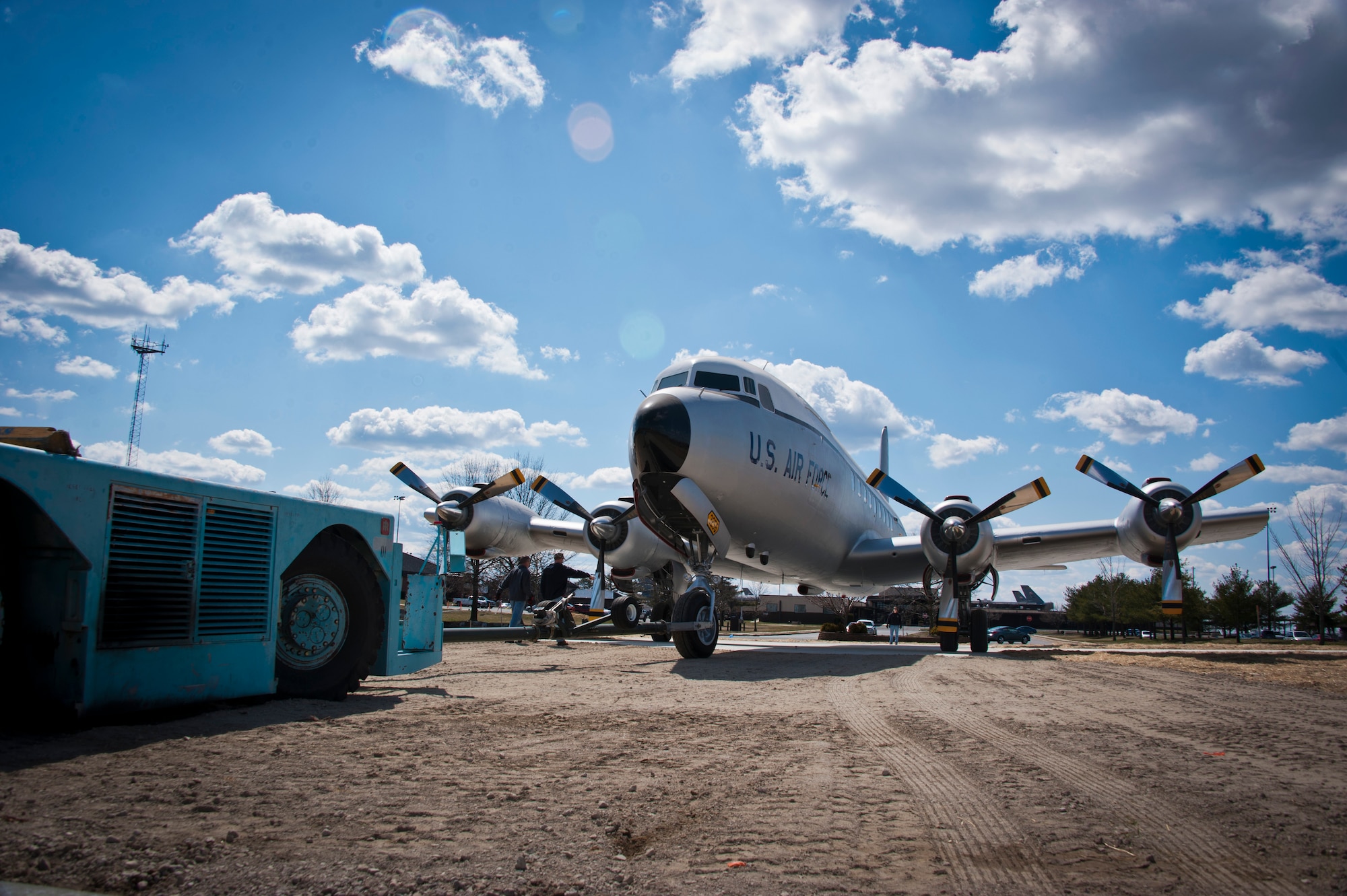 A C-118 Liftmaster is guided into its static display location in front of the McGuire Passenger Terminal on Joint Base McGuire-Dix-Lakehurst, N.J., March 30, 2013. A team volunteers from the 305th and 514th Air Mobility wings and 87th Air Base Wing moved the historic aircraft from Big Beige to its static display location. Volunteers have been restoring the aircraft since October 2009. (U.S. Air Force photo by Staff Sgt. David Carbajal/Released)