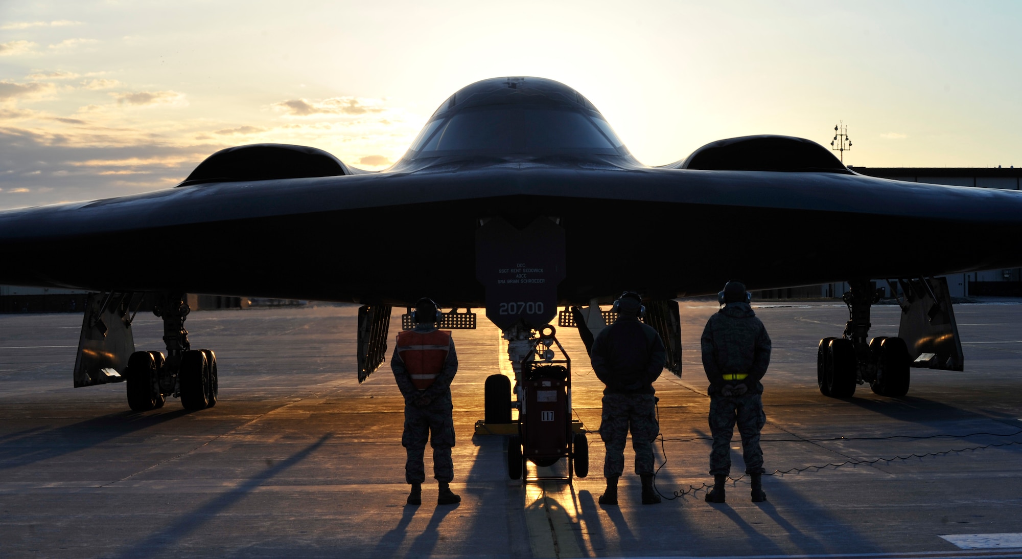 U.S. Air Force B-2 Spirit crew chiefs stand ready to perform maintenance on the “Spirit of Florida” after completing a historic training mission in which it became the first B-2 to reach 7,000 flight hours, Whiteman Air Force Base, Mo., April 1, 2013. Major Benjamin Kaminsky flew this historic mission, and crew chief Airman 1st Class Elijah Noel landed the aircraft. (U.S. Air Force photo by Airman 1st Class Keenan Berry/Released)