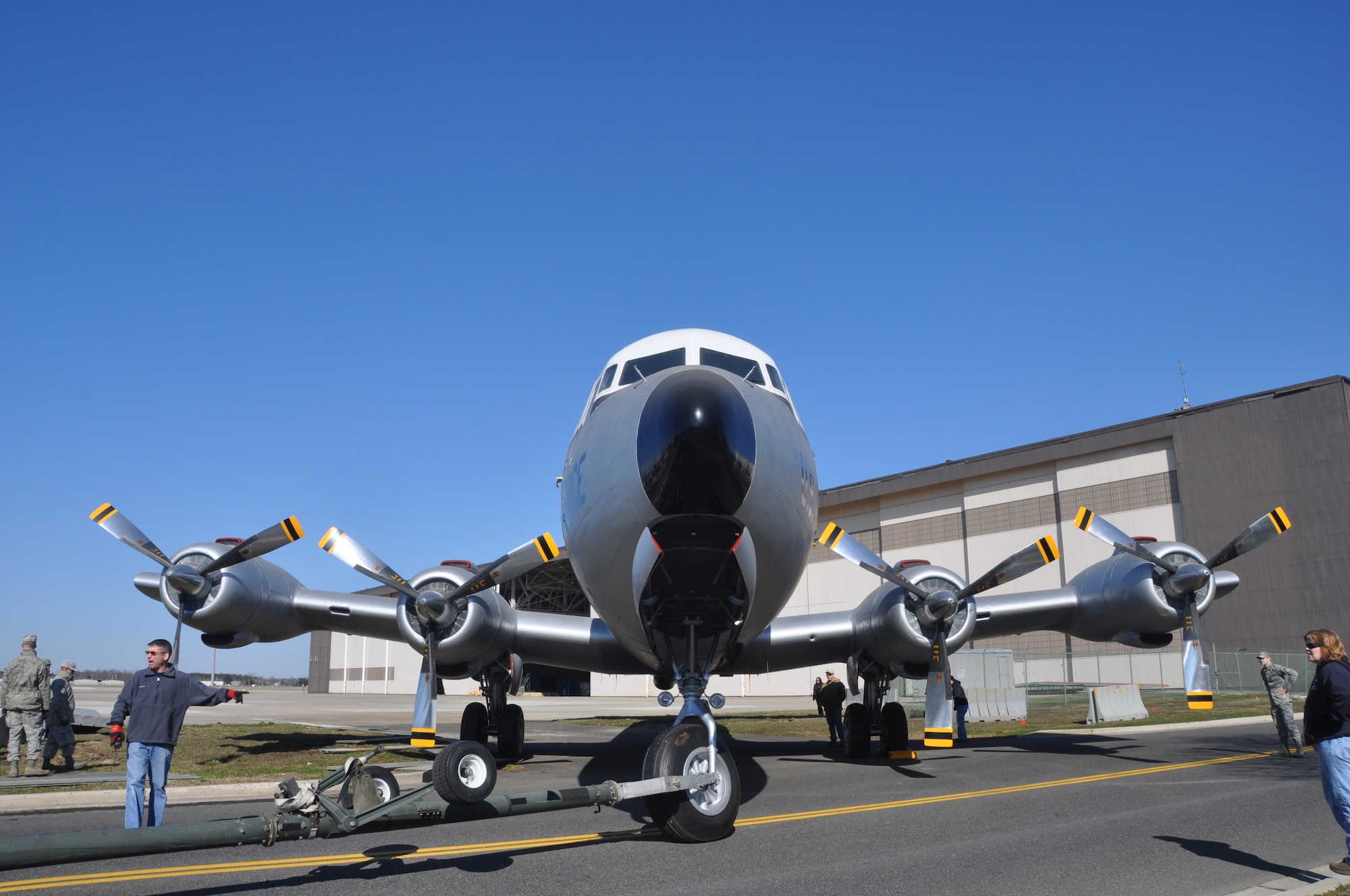 JOINT BASE MCGUIRE-DIX-LAKEHURST, N.J. - Volunteers from the 514th and 305th Air Mobility Wings and 87th Air Base Wing moved a newly refurbished C-118 Lift Master aircraft from an aircraft hangar to its static display location in front of the McGuire Passenger Terminal on March 23. (U.S. Air Force photo/Master Sgt. Donna T. Jeffries)