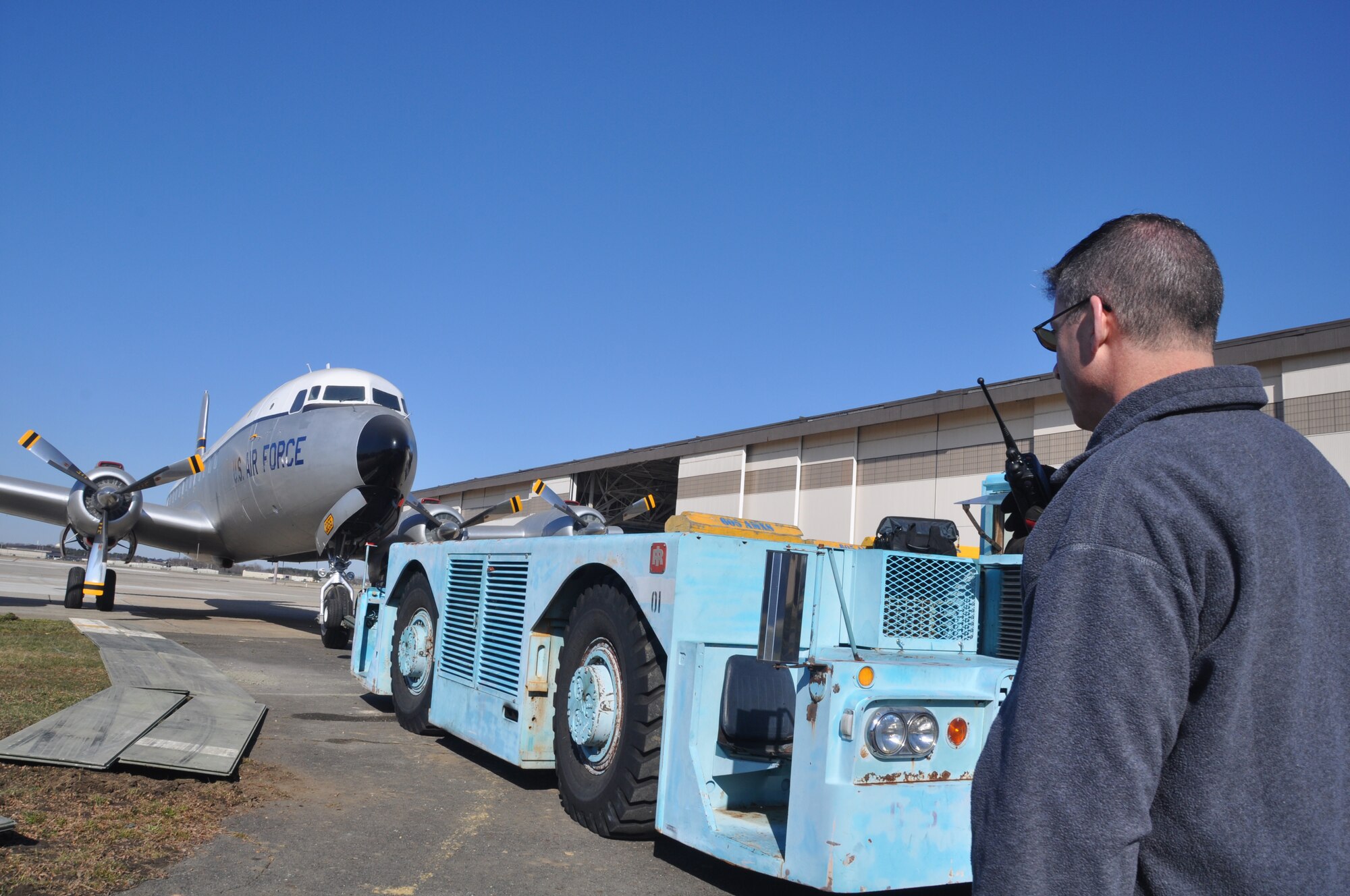 JOINT BASE MCGUIRE-DIX-LAKEHURST, N.J. - Volunteers from the 514th and 305th Air Mobility Wings and 87th Air Base Wing moved a newly refurbished C-118 Lift Master aircraft from an aircraft hangar to its static display location in front of the McGuire Passenger Terminal on March 23. (U.S. Air Force photo/Master Sgt. Donna T. Jeffries)