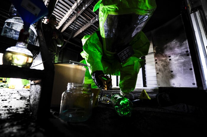 Michelle Bates, 628th Civil Engineer Squadron Emergency Management manager, uses a MultiRae, used to detect oxygen levels in the air, while scanning for simulated chemical contaminants during an exercise March 28, 2013, at Joint Base Charleston-Air Base, S.C. The response team was tasked to enter an area and collect and identify possible hazardous substances. The exercise gave the Emergency Management and Bioenvironmental Flights an opportunity to train for possible real world situations that may involve all hazards that may present a physical threat to the environment at Air Force installations worldwide. (U.S. Air Force photo by Staff Sgt. Rasheen Douglas)