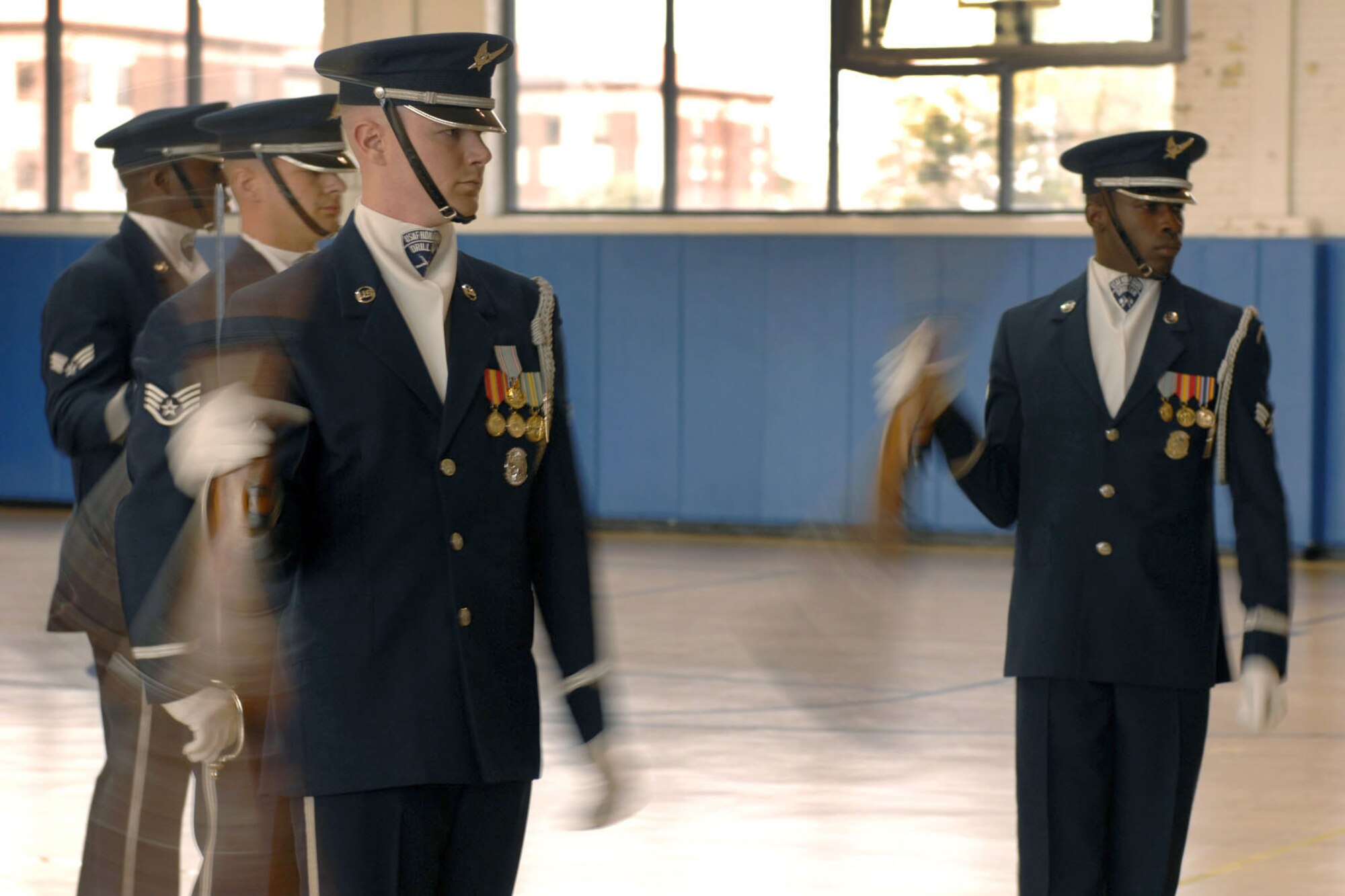 Members of the U.S. Air Force Honor Guard Drill Team perform a demonstration at the Air Combat Command Fitness Center at Langley Air Force Base, Va., March 29, 2013. The drill team came to coach Langley’s honor guard members, as well as to perform a demonstration at the ACC Fitness Center to recruit Airmen for the drill team. (U.S. Air Force photo by Staff Sgt. Jeff Nevison/Released)