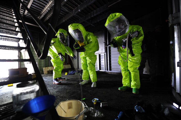 (Left to right) Tech. Sgt. Glynn Drummonds, 628th Medical Group bioenvironmental engineer journeyman, Michelle Bates, 628th Civil Engineer Squadron Emergency Management manager and Senior Airman Ross Kreikemeier, 628th Civil Engineer Squadron Emergency Management Flight, simulate scanning for hazardous substances during an exercise March 28, 2013, at Joint Base Charleston-Air Base, S.C. The exercise gave the Emergency Management and Bioenvironmental Flights an opportunity to train for possible real world situations that may involve all hazards that may present a physical threat to the environment at Air Force installations worldwide. (U.S. Air Force photo by Staff Sgt. Rasheen Douglas)