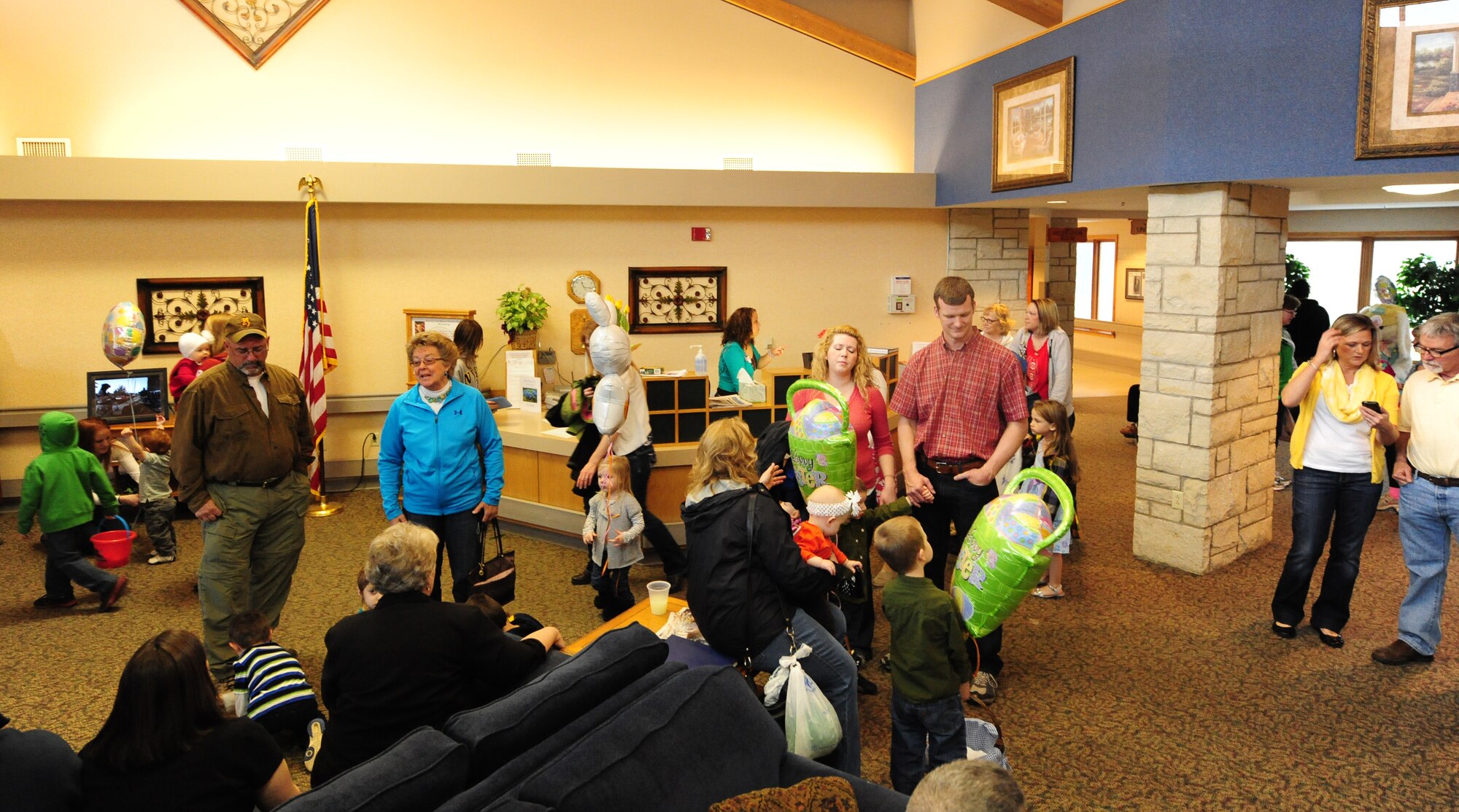Veterans, children and volunteers from Whiteman Air Force Base, the University of Central Missouri and the local community participate in the Missouri Veterans Home’s second annual Easter Egg Hunt and family celebration in Warrensburg, Mo., March 30, 2013. Even though heavy rain did not allow the event to take place outside, veterans and volunteers were still able to hide more than 1,800 eggs throughout the building. (U.S. Air Force photo by Staff Sgt. Nick Wilson/Released)