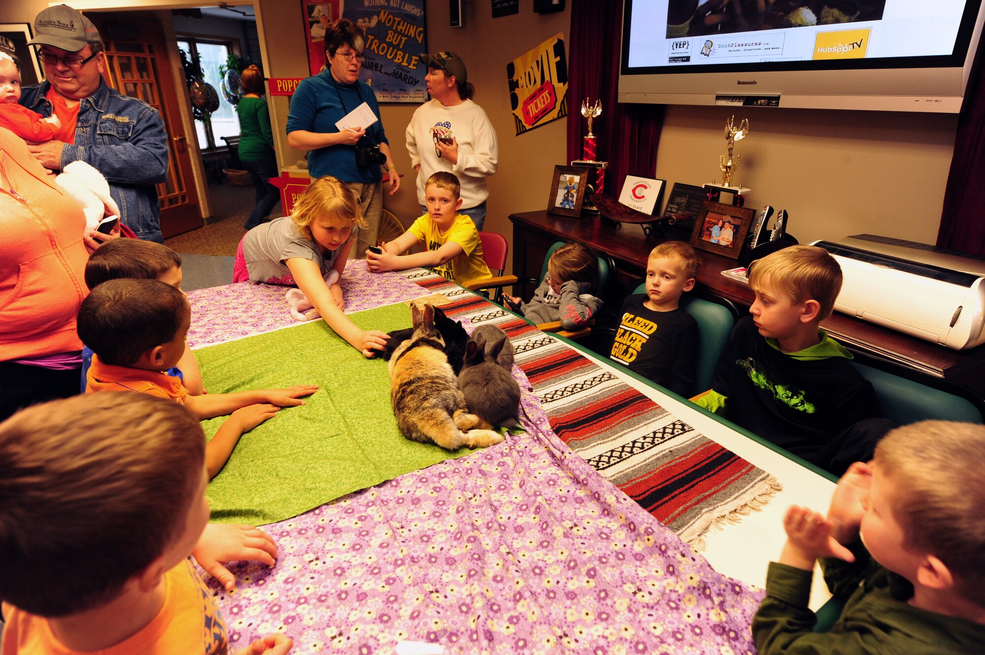 Children take turns petting rabbits at the Missouri Veterans Home’s second annual Easter Egg Hunt and family celebration in Warrensburg, Mo., March 30, 2013. With support from volunteer groups from Whiteman Air Force Base and the local community, the veterans home offered the free event to more than 200 children. (U.S. Air Force photo by Staff Sgt. Nick Wilson/Released)