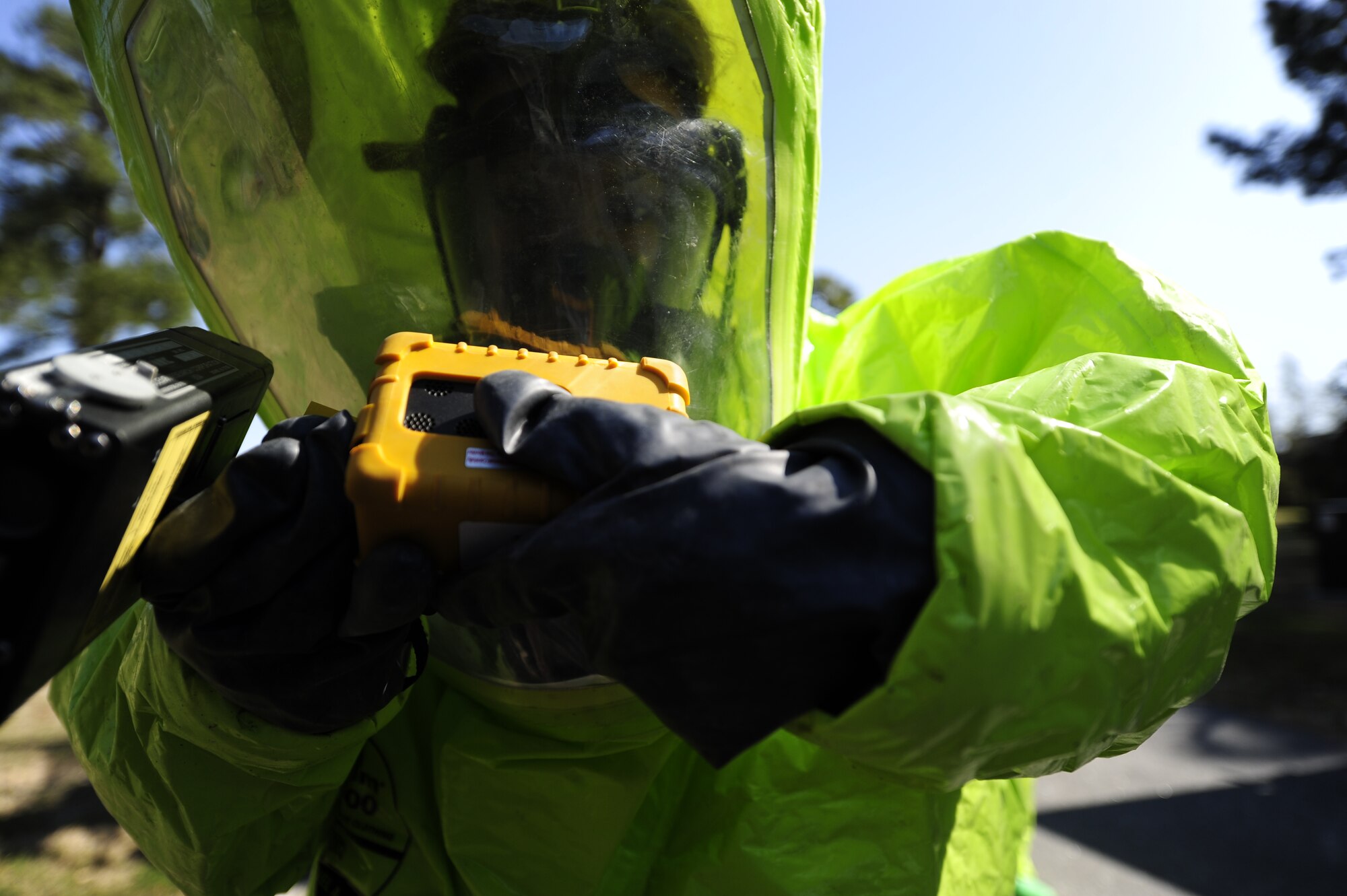 Michelle Bates, 628th Civil Engineer Squadron Emergency Management manager, preps her equipment before scanning a simulated hazardous area during an exercise March 28, 2013, at Joint Base Charleston-Air Base, S.C.  Bates was a member of the second response team during the exercise and was responsible for collecting and identifying possible hazardous substances. The exercise gave the Emergency Management and Bioenvironmental Flights an opportunity to train for possible real-world situations involving all hazards that may present a physical threat to the environment at Air Force installations worldwide.
 (U.S. Air Force photo by Staff Sgt. Rasheen Douglas)