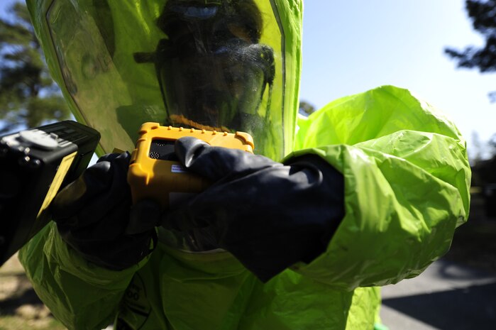 Michelle Bates, 628th Civil Engineer Squadron Emergency Management manager, preps her equipment before scanning a simulated hazardous area during an exercise March 28, 2013, at Joint Base Charleston-Air Base, S.C.  Bates was a member of the second response team during the exercise and was responsible for collecting and identifying possible hazardous substances. The exercise gave the Emergency Management and Bioenvironmental Flights an opportunity to train for possible real-world situations involving all hazards that may present a physical threat to the environment at Air Force installations worldwide.
 (U.S. Air Force photo by Staff Sgt. Rasheen Douglas)