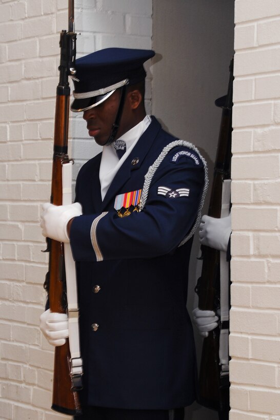 U.S. Air Force Senior Airman Jimmy Pryor, U.S. Air Force Honor Guard Drill Team member performs during a recruitment visit at Langley Air Force Base, Va., March 29, 2013. The Honor Guard Drill Team performance featured professionally choreographed sequence maneuvers, tosses and complex weapon exchanges. (U.S. Air Force photo by Airman 1st Class Victoria H. Taylor/Released)