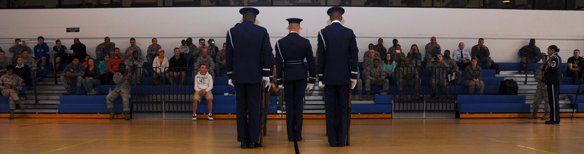 U.S. Air Force Honor Guard Drill Team performs in front of a crowd during a recruitment visit at Langley Air Force Base, Va., March 29, 2013. The Drill Team promotes the Air Force mission by showcasing drill performances at public and military venues to recruit retain and inspire Airmen. (U.S. Air Force photo by Airman 1st Class Victoria H. Taylor/Released)