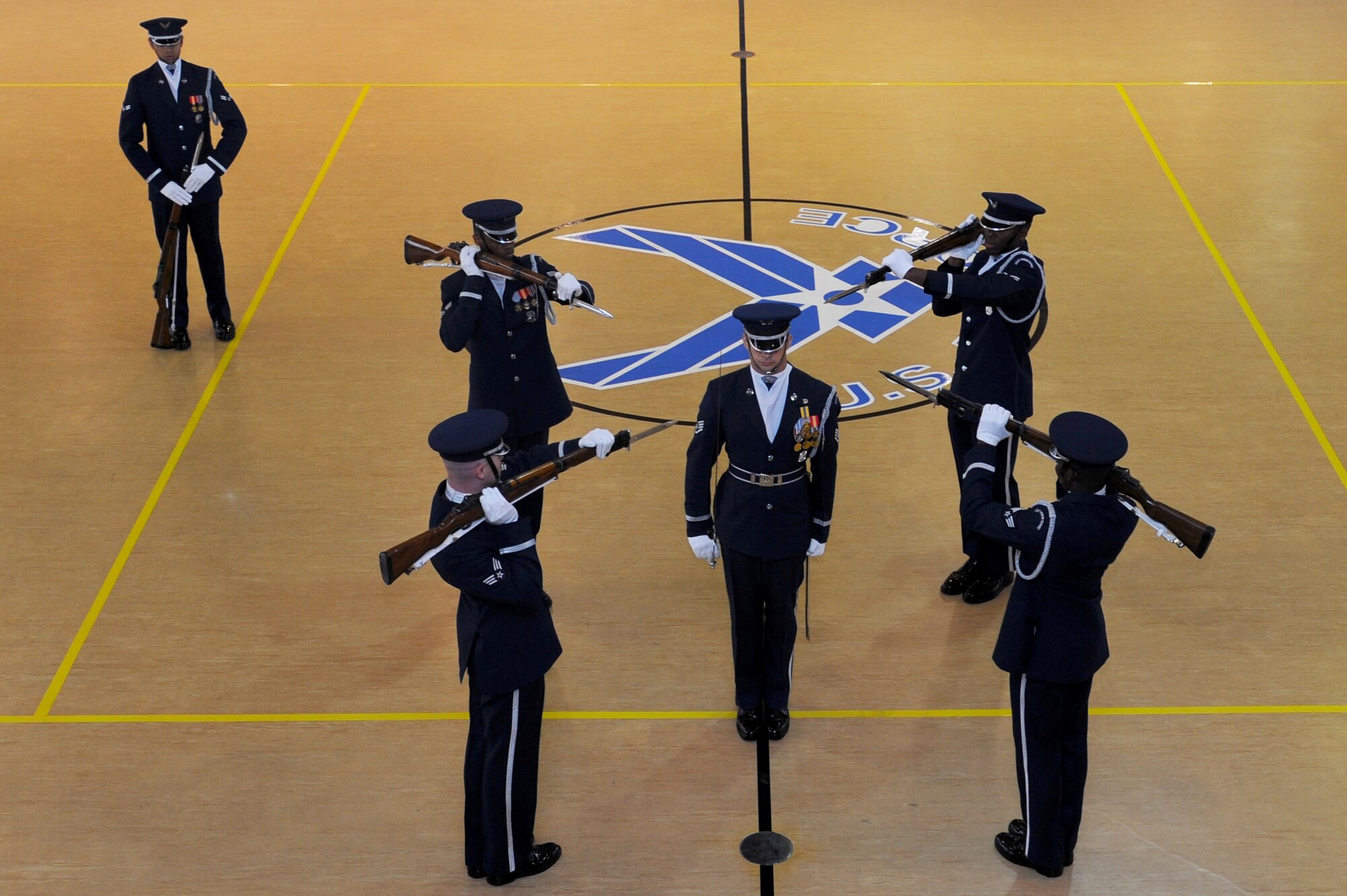 U.S. Air Force Honor Guard Drill Team performs precise movements during a recruitment visit at Langley Air Force Base, Va., March 29, 2013.  The mission of the Air Force Honor Guard is to represent Airmen to the American public and the world. (U.S. Air Force photo by Airman 1st Class Victoria H. Taylor/Released)