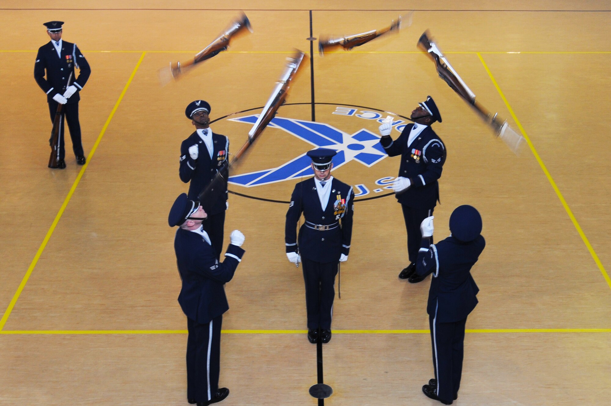 U.S. Air Force Honor Guard Drill Team performs precise movements during a recruitment visit at Langley Air Force Base, Va., March 29, 2013.  The mission of the Air Force Honor Guard is to represent Airmen to the American public and the world. (U.S. Air Force photo by Airman 1st Class Victoria H. Taylor/Released)