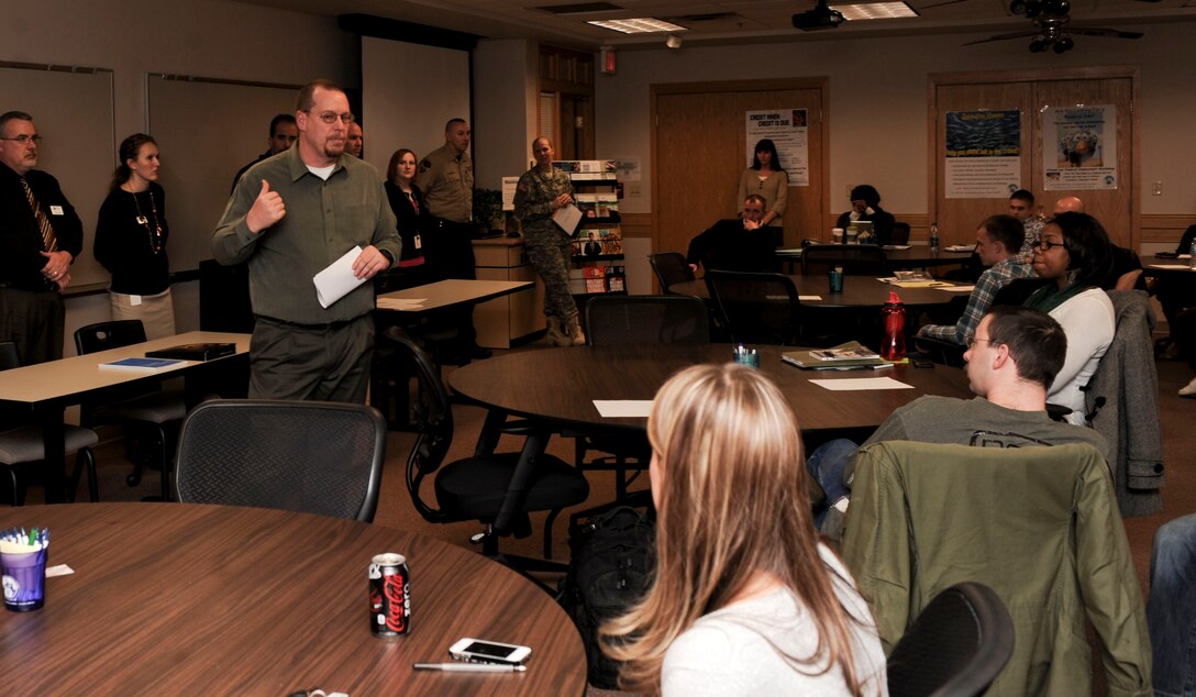 Jeffrey Hollinshead, Airman and Family Readiness Center community readiness consultant, introduces employer representatives during a “Meet The Employer” workshop at the Rushmore Center on Ellsworth Air Force Base, S.D., March 26, 2013. The event was intended to help Ellsworth Airmen considering separation from the service to understand the various employment opportunities available in the local area. (U.S. Air Force photo by Airman 1st Class Anania Tekurio/Released)