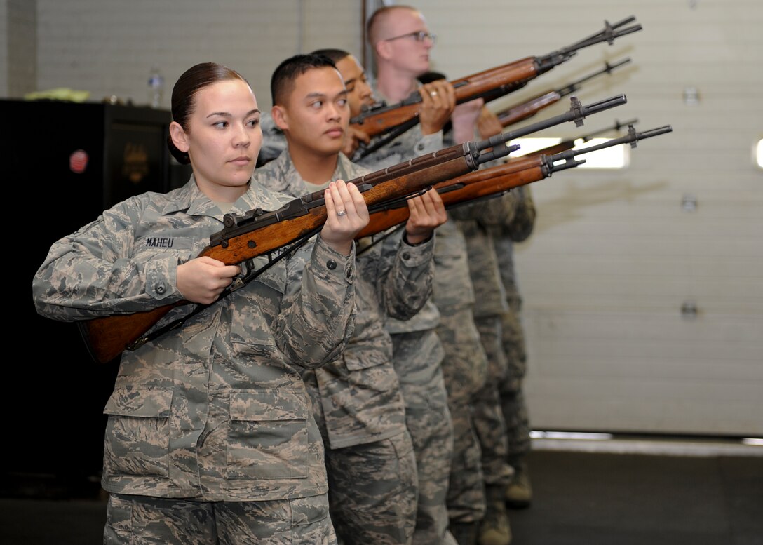 U.S. Air Force Airmen practice precise movements to demonstrate their ability as the base honor guard at Langley Air Force Base, Va., March 29, 2013. U.S. Air Force Honor Guard spent the morning advising the Airmen to help improve their skills.(U.S. Air Force photo by Airman 1st Class Kimberly Nagle/Released)