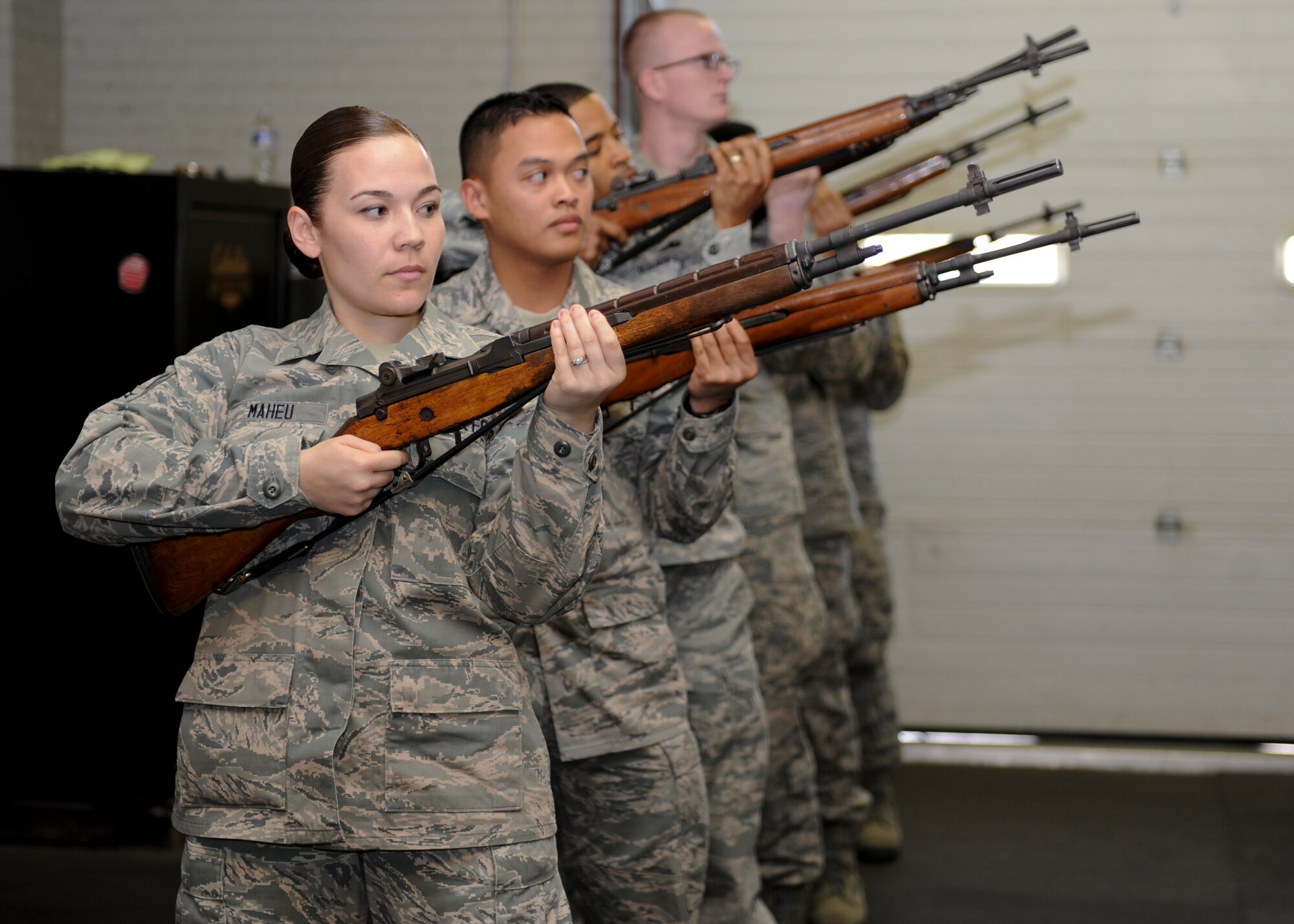U.S. Air Force Airmen practice precise movements to demonstrate their ability as the base honor guard at Langley Air Force Base, Va., March 29, 2013. U.S. Air Force Honor Guard spent the morning advising the Airmen to help improve their skills.(U.S. Air Force photo by Airman 1st Class Kimberly Nagle/Released)
