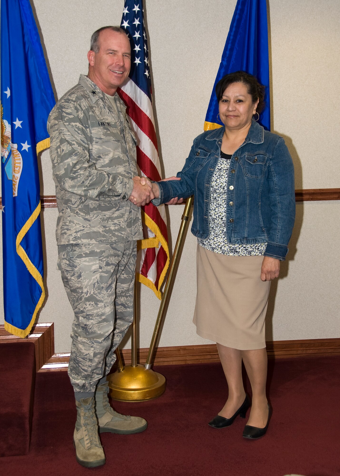 Gina Orue, a resource adviser for the 982nd Maintenance Squadron, is congratulated by Brig. Gen. Michael Fantini, 82nd Training Wing commander, for being the Wingman of Choice. Orue was given the award due to her professionalism and work ethic. (U.S. Air Force photo by Frank Carter)