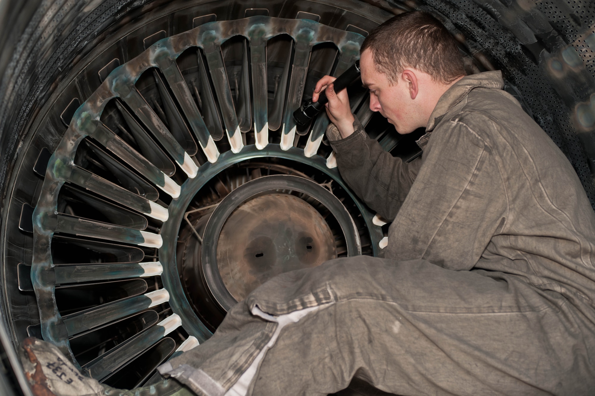 Senior Airman Terry Morris, 28th Aircraft Maintenance Squadron aerospace propulsion technician, examines the exhaust systems of a B-1 bomber for damage during an inspection at Ellsworth Air Force Base, S.D., March 28, 2013. Aerospace propulsion technicians are one of six specialties in the 28th Maintenance Group’s specialist section responsible to keep more than turbofan engines mission-ready. (U.S. Air Force photo by Airman 1st Class Zachary Hada/Released)