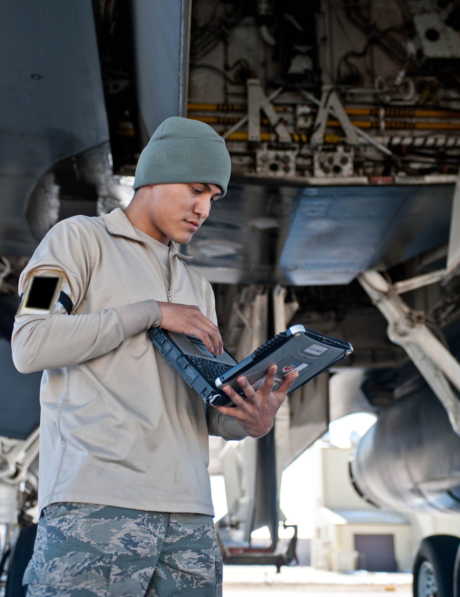 Airman 1st Class Stefon Douglas, 28th Aircraft Maintenance Squadron aerospace propulsion technician, reviews a technical order while performing a safety inspection on a B-1 bomber’s propulsion system at Ellsworth Air Force Base, S.D., March 28, 2013. The 28th AMXS is the largest squadron in the 28th Bomb Wing, with more than 700 Airmen supporting Ellsworth’s combat coded B-1 bombers. (U.S. Air Force photo by Airman 1st Class Zachary Hada/Released)