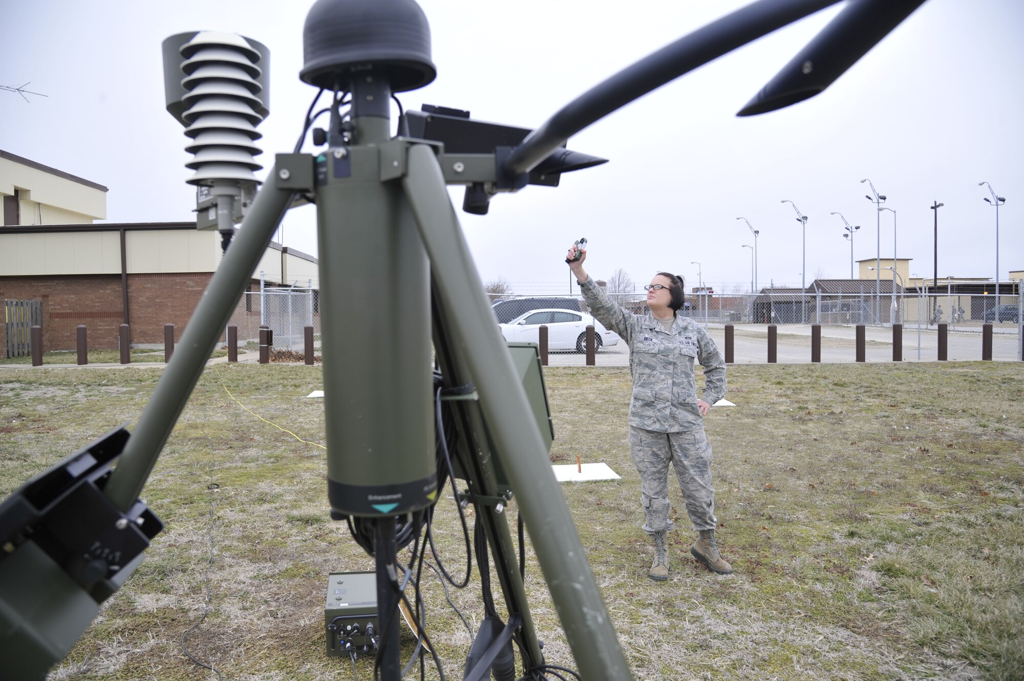 U.S. Air Force Senior Airman Heather Rieck, 509th Operation Support Squadron weather journeyman, holds up a kertrel sensor, Whiteman Air Force Base, Mo., March 20, 2013. The kertrel sensor, like the TMQ-53, measures wind speed, temperature, wind direction and pressure. (U.S. Air Force photo by Airman 1st Class Keenan Berry/Released)  
