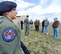 Staff Sgt. Holly Stanton, foreground, and SSgt. Mark Karas, Phoenix Raven's of the 436th Security Forces Squadron, brief a group of honorary commanders on their mission responsibilities during a tour March 28, 2013, Dover Air force Base, Del. (U.S. Air Force photo/Greg L. Davis)