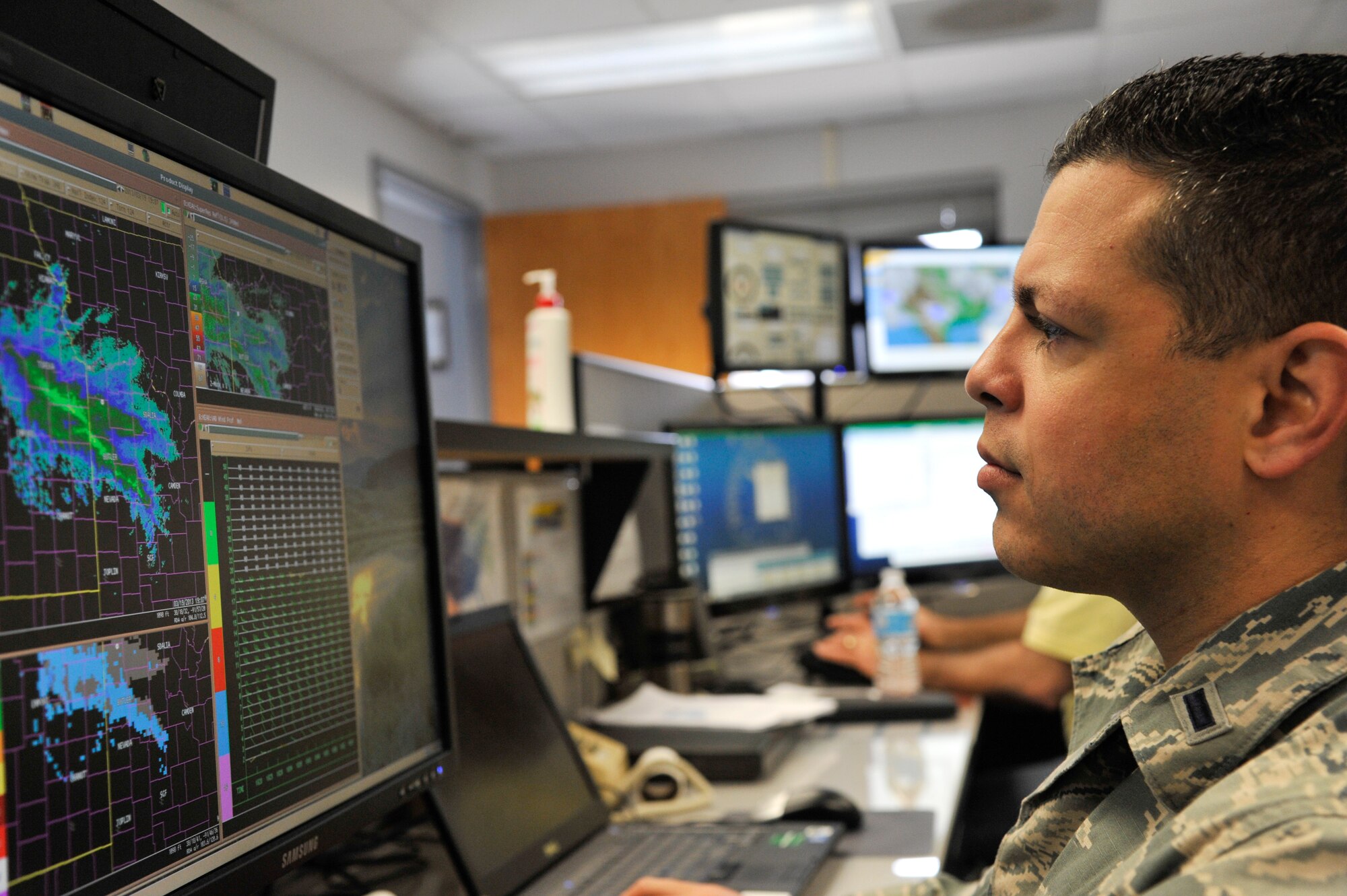 U.S Air Force 1st Lt. Jose Melendez, 509th Operation Support Squadron wing weather officer,examines weather radar readouts, Whiteman Air Force Base, Mo., March 20, 2013. Radar sensors send outpulses to provide weather personnel with information on incoming clouds, precipitation, winds and other natural occurrences. (U.S. Air Force photo by Airman 1st Class Keenan Berry/Released)  
