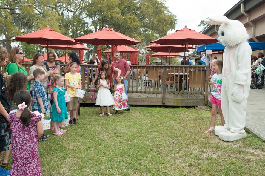 The Easter Bunny poses for pictures with children during the Moody Air Force Base, Ga., Annual Easter Egg Hunt March 31, 2013. The 23d Force Support Squadron hosted the event that also included brunch, games and a bounce house. (U.S. Air Force photo/Airman Paul Francis Released)