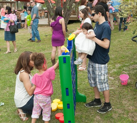 Family Members take part in the Moody Air Force Base, Ga., Annual Easter Egg Hunt March 31, 2013. More than 250 children attended the hunt with their families scavenging the Moody Field Club for Easter eggs. (U.S. Air Force photo/Airman Paul Francis Released)