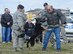 Military working dog 'Body' bites the arm of Mr. David McClellan, 512th Maintenance Group honorary commander while his handler, Staff Sgt. Nicholas Lewis gives commands to the dog at Dover Air Force Base, Del. Honorary Commanders, along with their military unit counterparts, received an in-depth tour of Dover AFB functional units and facilities, March 28, 2013. (U.S. Air Force photo/Greg L. Davis)