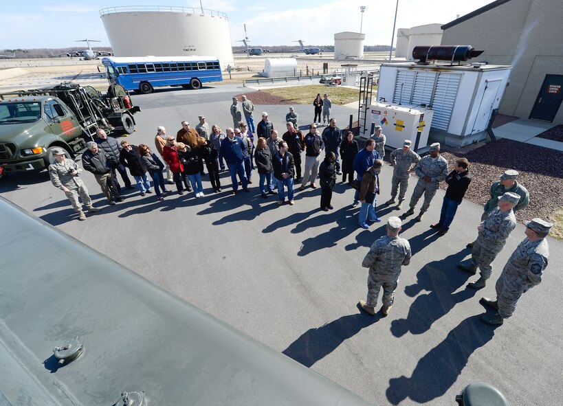 Shown from atop a green fuel truck, civilians honorary commanders receive a brief about the capabilities of the 436th Logistics Readiness Squadron/Fuels Flight, Dover Air Force Base, Del., March 28, 2013. In the background are the large fuel tanks which supply the large transport aircraft operating from Dover. Dover has a new batch of honorary commanders who, along with their military unit counterparts, received an in-depth tour and introduction to the capabilities of Dover AFB's functional units, March 28, 2013. (U.S. Air Force photo/Greg L. Davis)