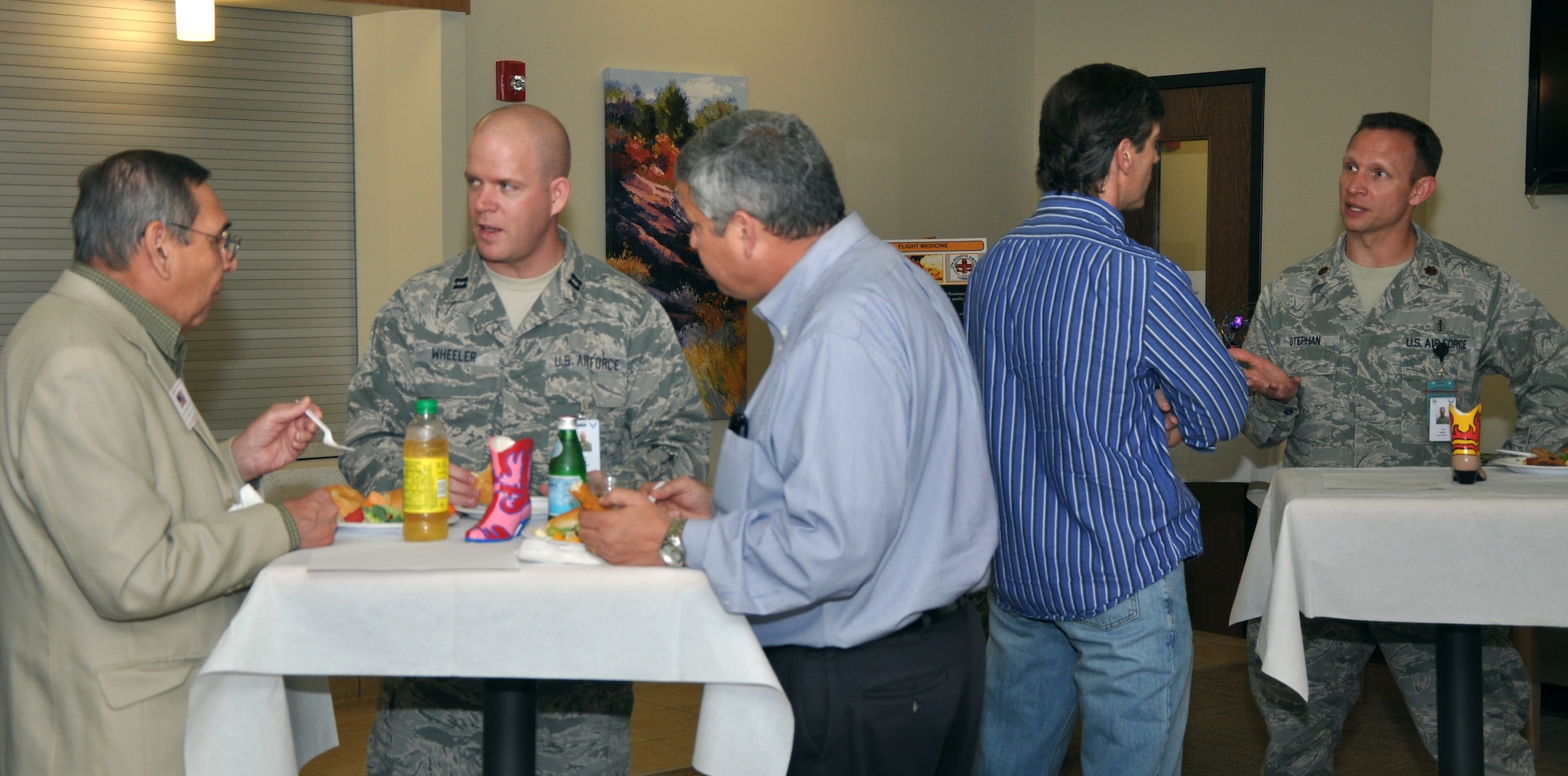 GOODFELLOW AIR FORCE BASE, Texas – Civilians from the Ross Clinic referrals program and Ross Clinic personnel chat at the provider collaboration meeting in the Ross Clinic, here, March 28. The meeting provided civilians a chance to meet clinic personal and receive information on the squadrons they work in. (U.S. Air Force photo/ Airman 1st Class Joshua Edwards)